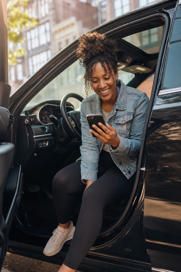 Rideshare driver checking RevvFi from the driver's seat